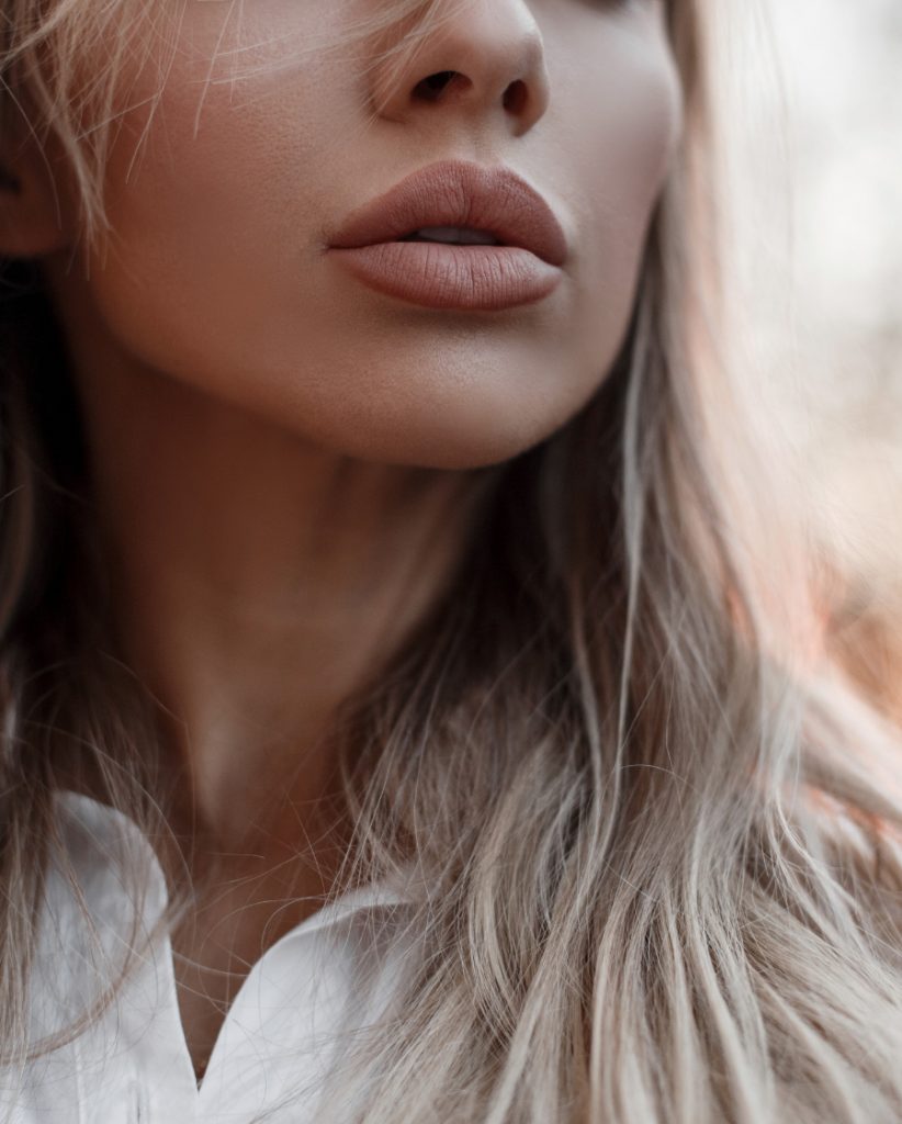 Close-up on a woman's lips after dermal fillers