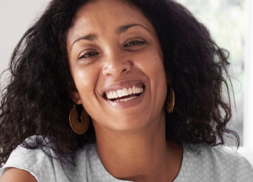Smiling middle-age woman after SmartXide Skin™ Resurfacing